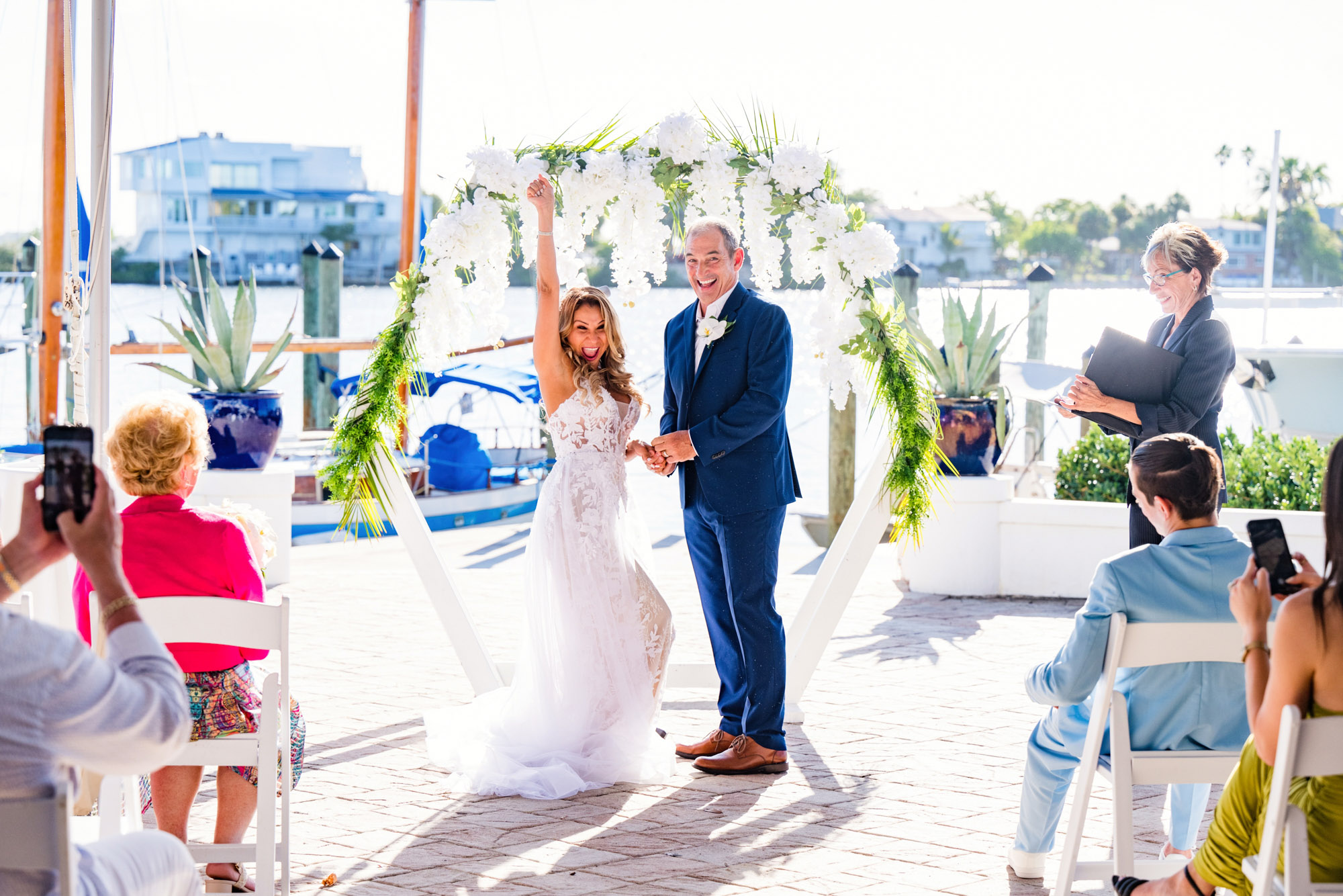Bride celebrating her wedding ceremony on the Eau Gallie Yacht club