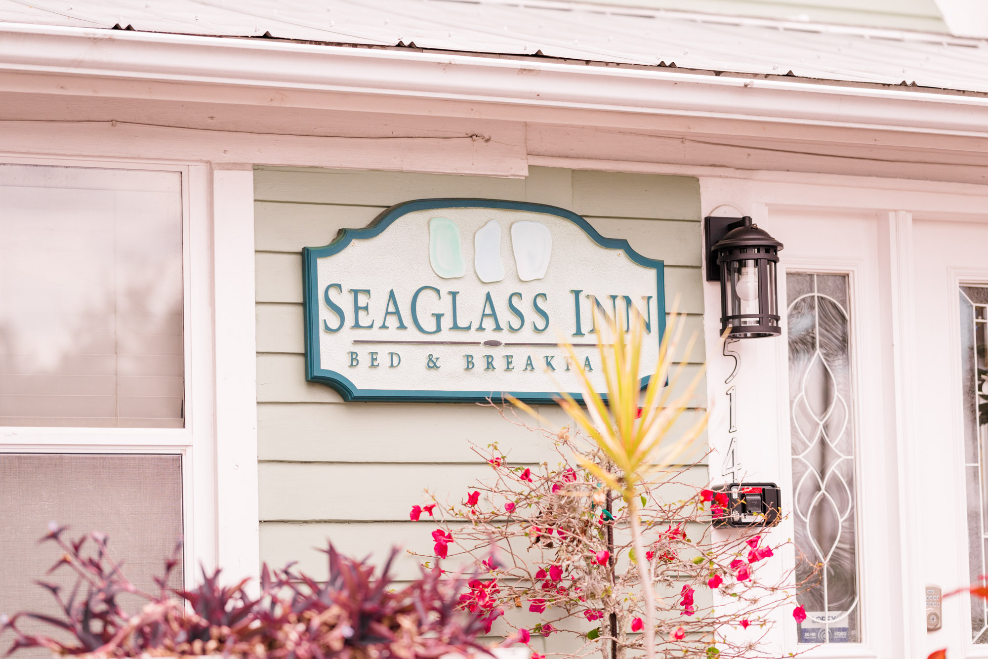 Picture of the sign in front of the Seaglass Inn in Melbourne Beach