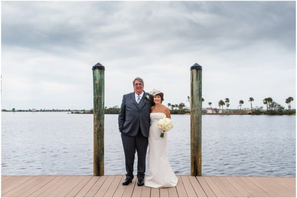 Bride and groom outside by boats Eau Gallie Yacht Club Wedding